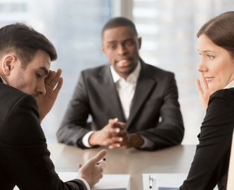 Couple sitting with lawyer