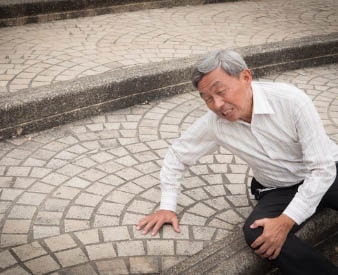 Man holding knee in pain