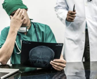 Doctor covering face