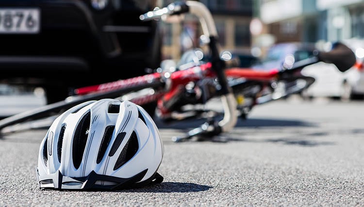 Bicycle on ground after collision with vehicle