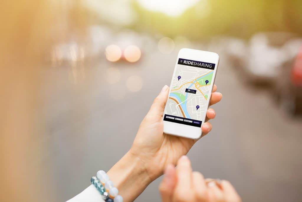 rideshare app hailing a ride on the phone