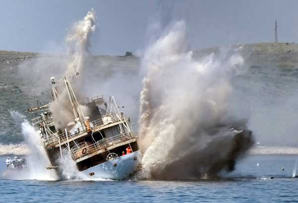 boat collision with impact spraying water outward