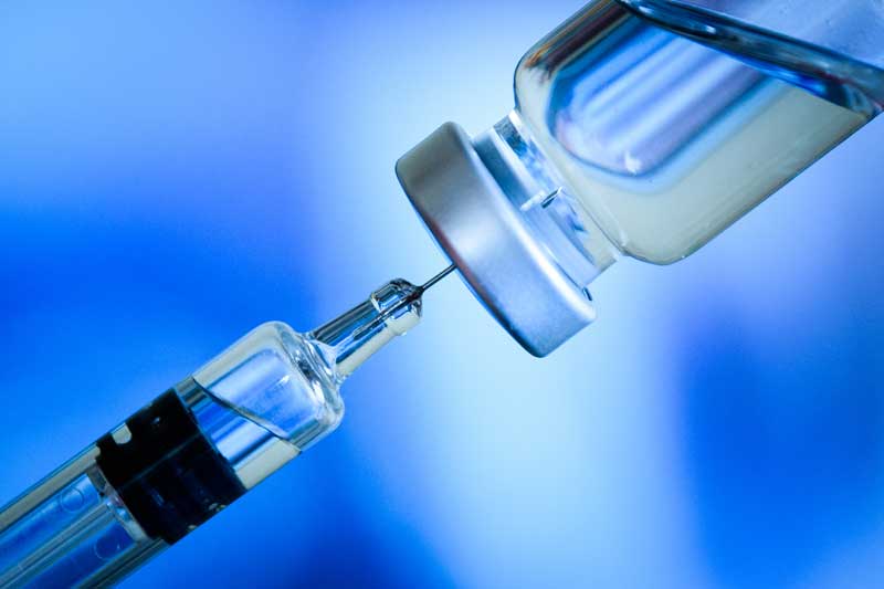 vaccine bottle with shot