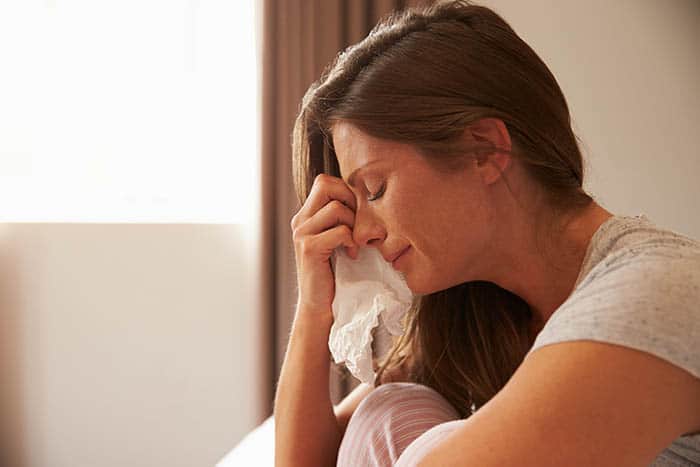 Woman crying after traumatic event