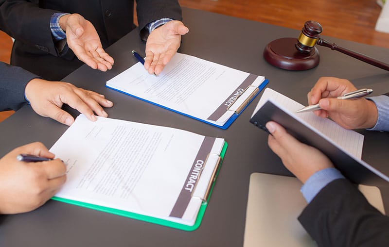 Business partners entering into joint liability agreement