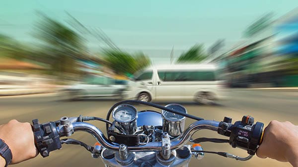 Motorcycle racing through intersection
