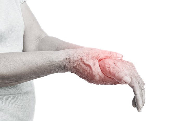 Man with nerve damage pain in wrist