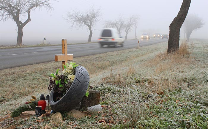 Grave on side of road after car accident