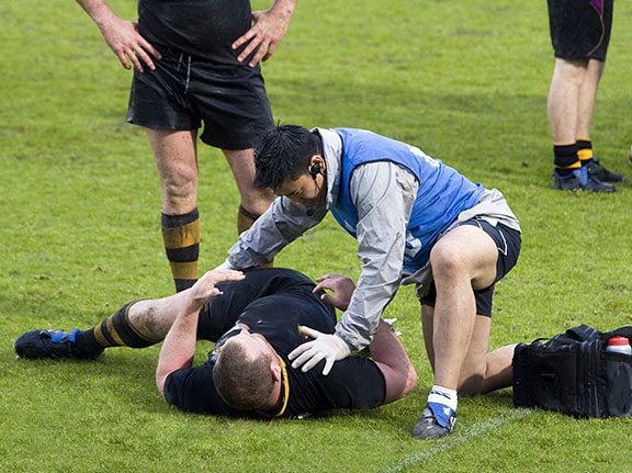 Rugby player on ground after sports injury
