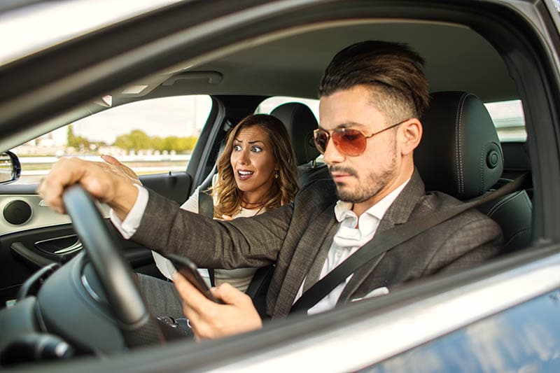 Driver texting while passenger is stunned