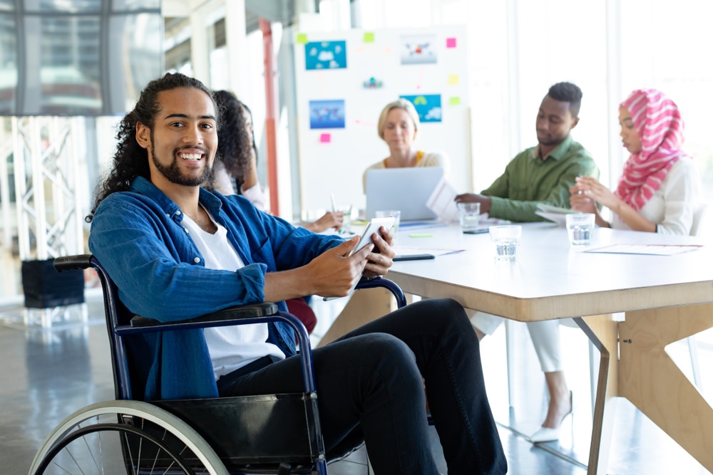 Diverse group of employees smiling for picture