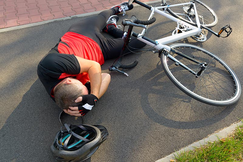Bicyclist suffering head injury resulting from accident