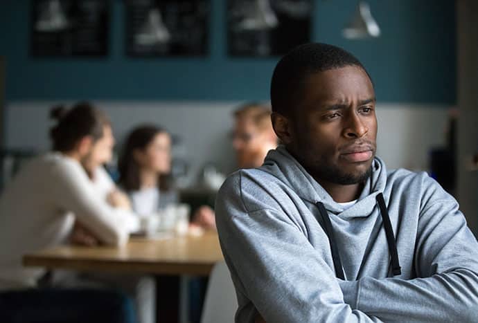 African American employee looking discouraged