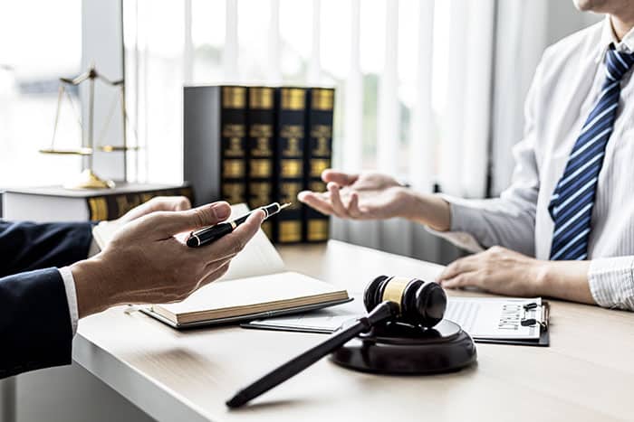 Attorney speaking to client about defamation