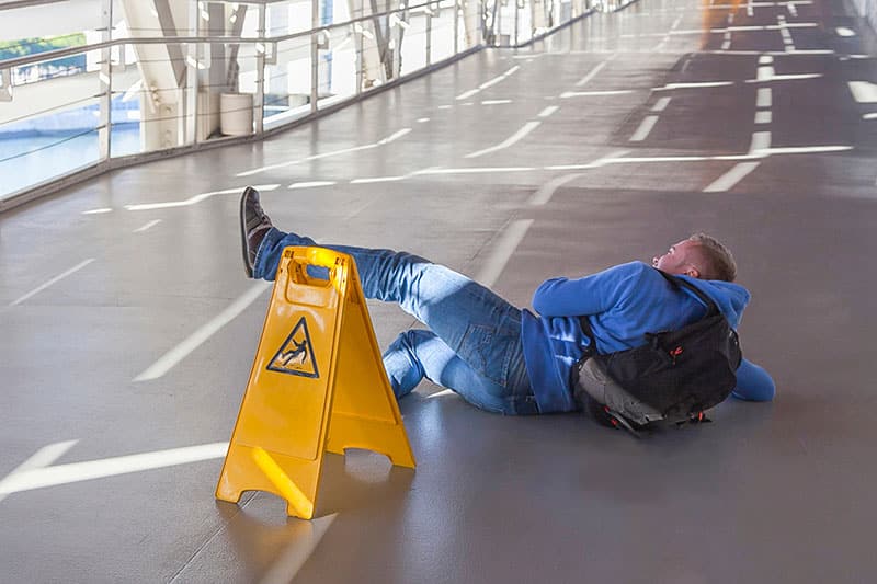 Man falling down on wet freeway overpass