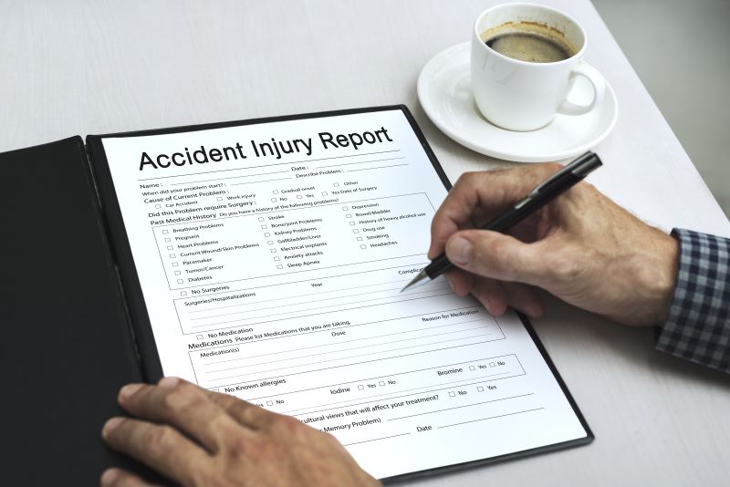 Person filling out an accident injury report