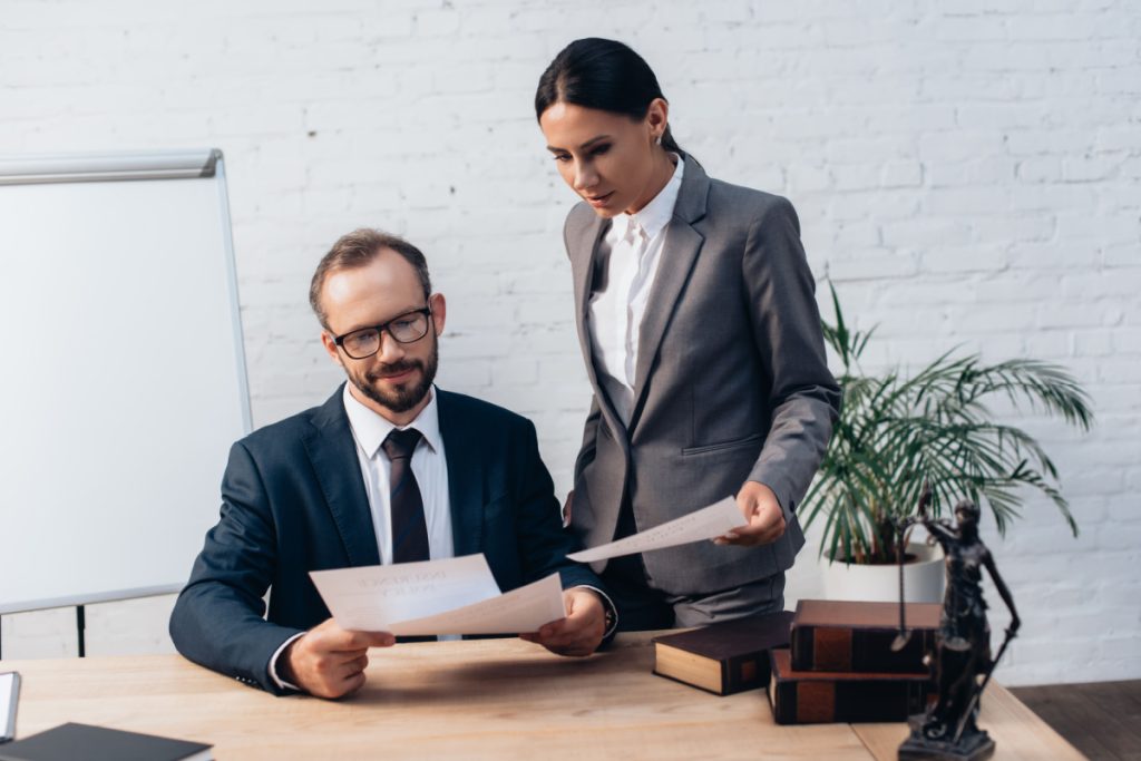 two people looking at a document