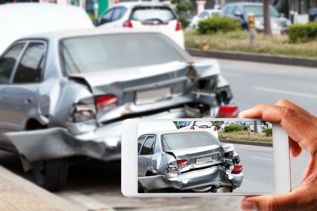 taking photo of car accident rear bumper