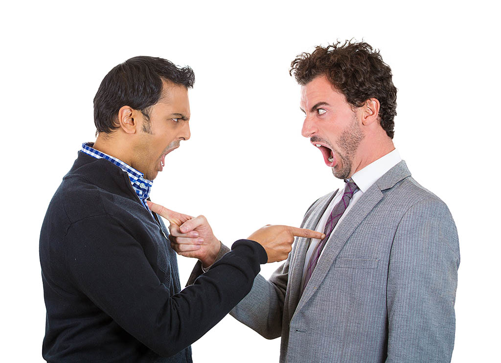 Two employees pointing finger at each other and screaming angrily