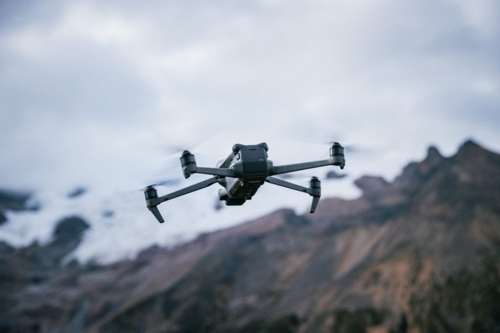 Drone flying on high altitude mountain top